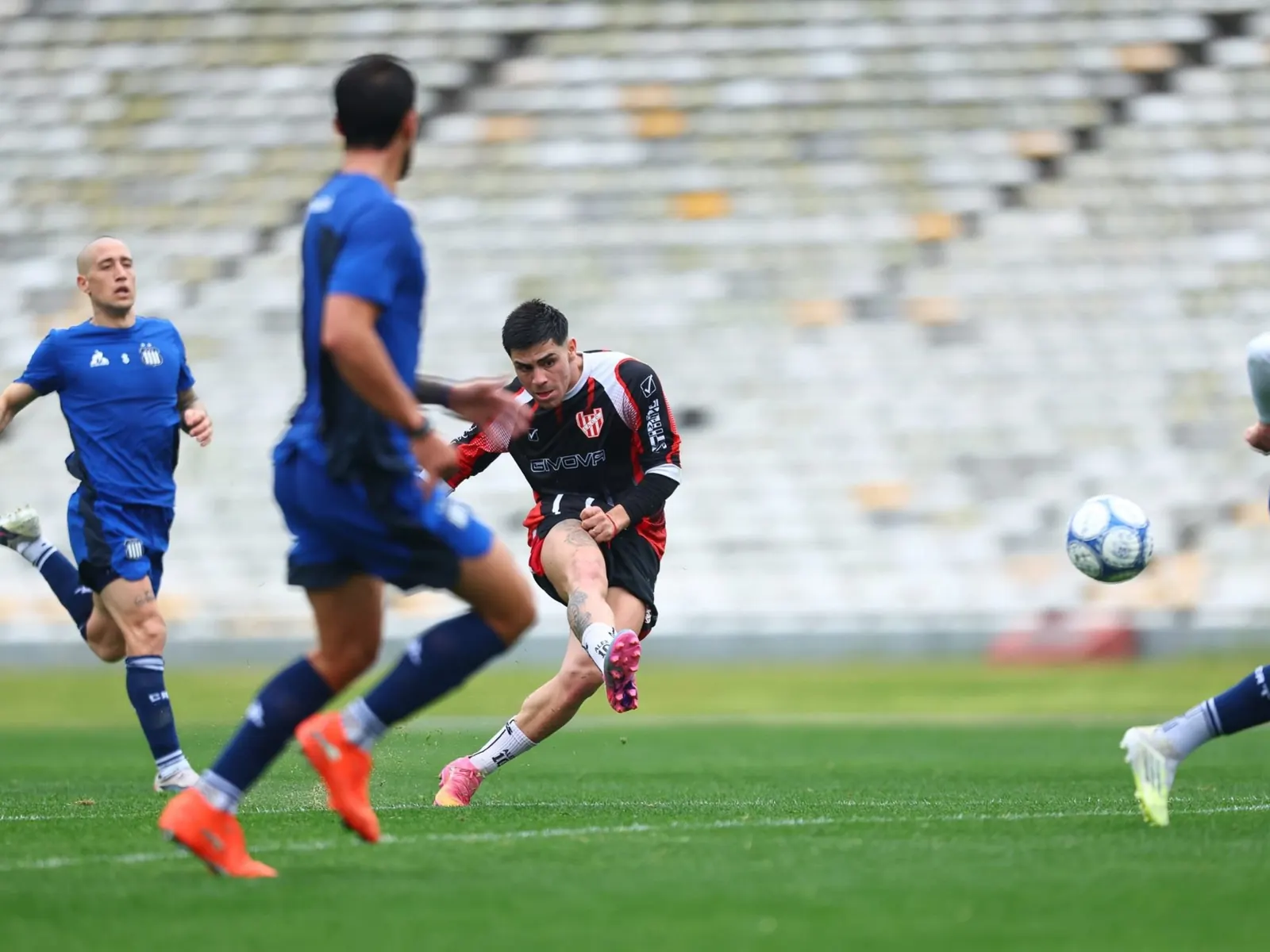 Argentine football players in action during a pre-season friendly match.