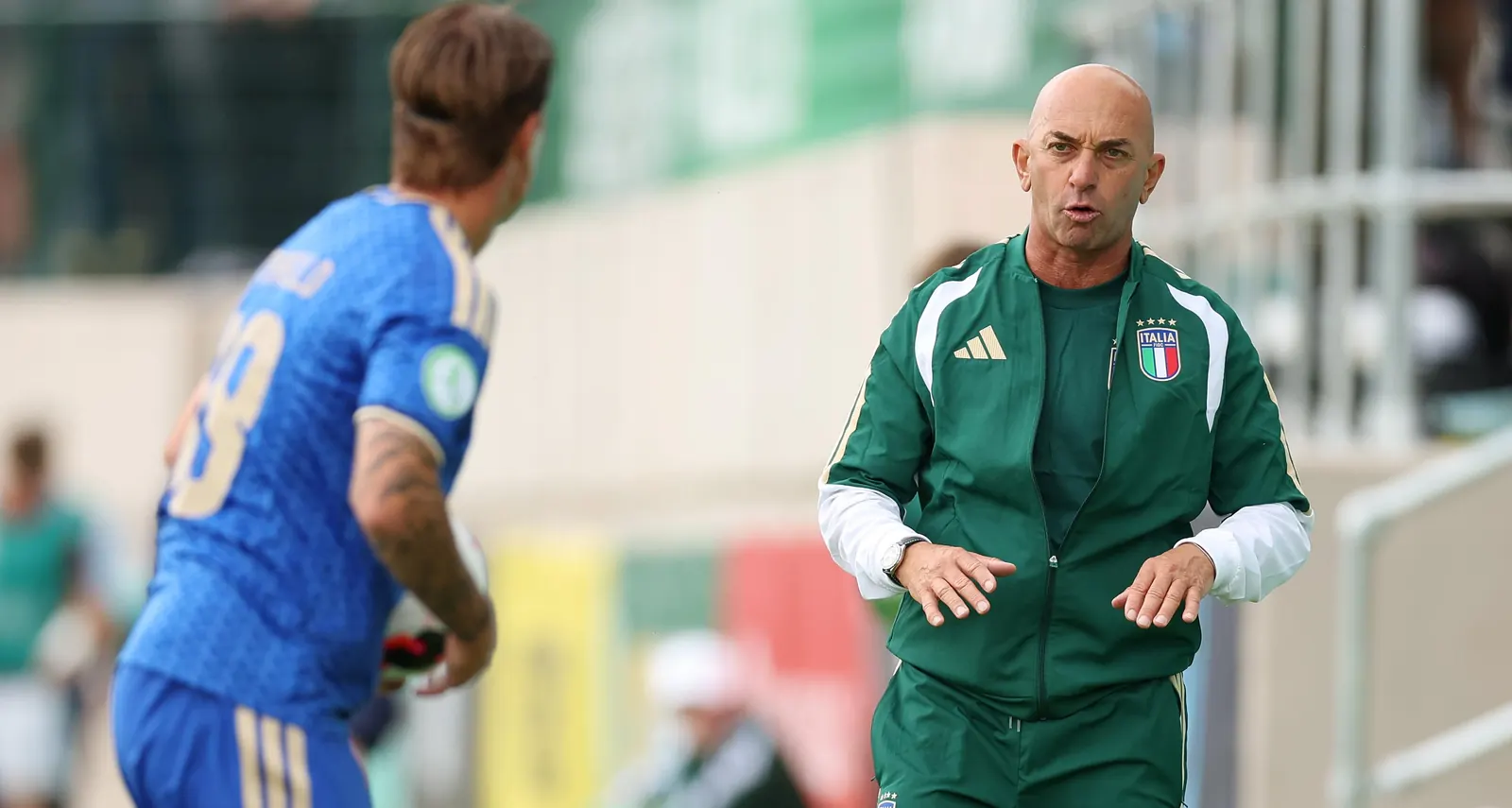 Italy's Under-19 national football team practicing on a field.
