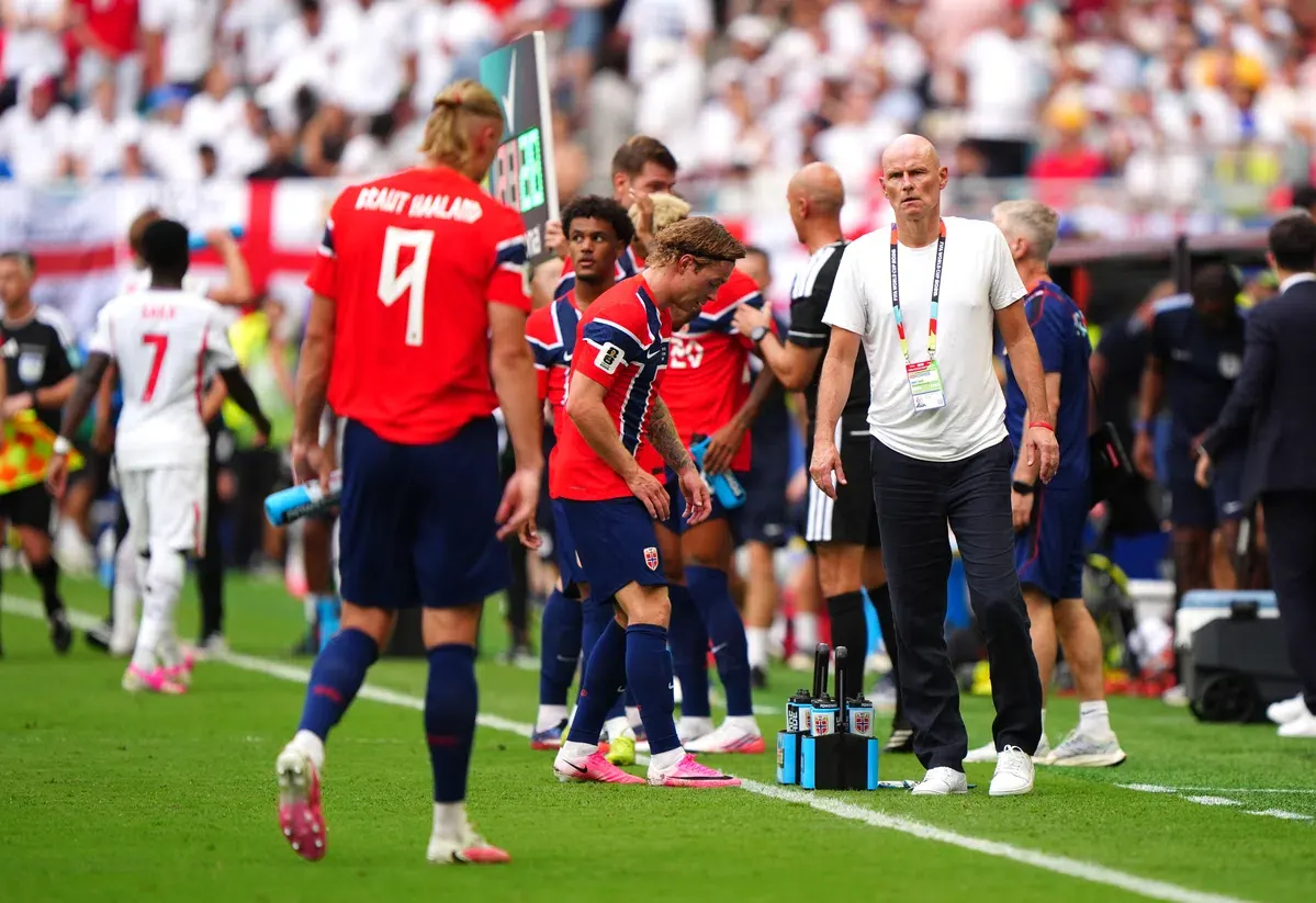 Jude Bellingham celebrates scoring a goal for England.