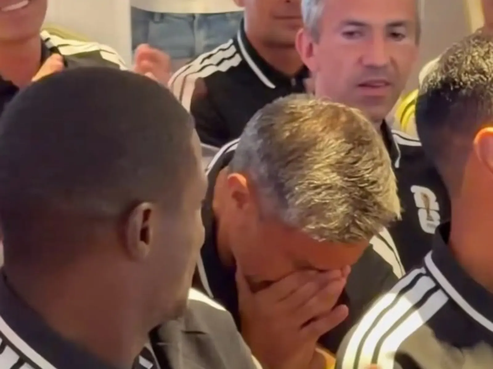 Referee Slavko Vincic looking emotional on the sidelines of a football pitch.
