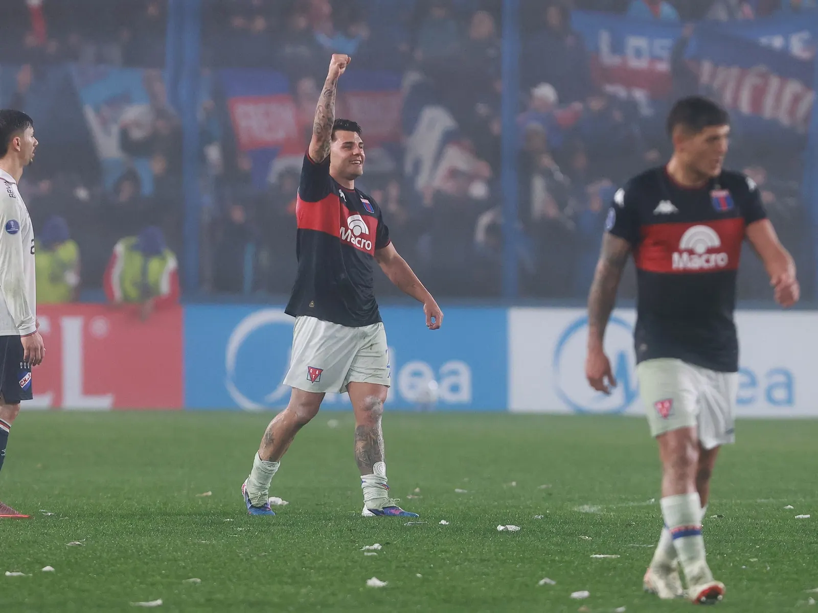 Nacional and Tigre players contest a Copa Sudamericana match in Montevideo