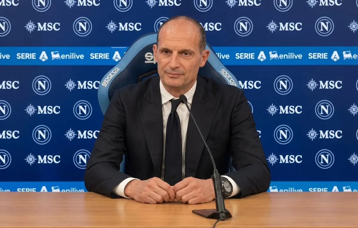 Massimiliano Allegri speaks at a press conference, likely during his unveiling as Napoli's new coach.