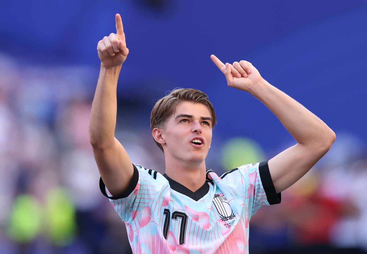 Charles De Ketelaere in a Belgium national team kit applauding fans at the 2026 FIFA World Cup.