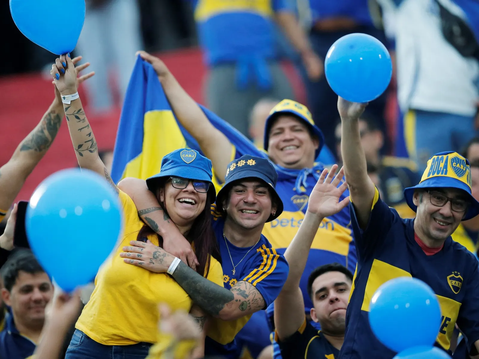 Boca Juniors supporters with flags and banners at Defensores del Chaco stadium in Asuncion, Paraguay