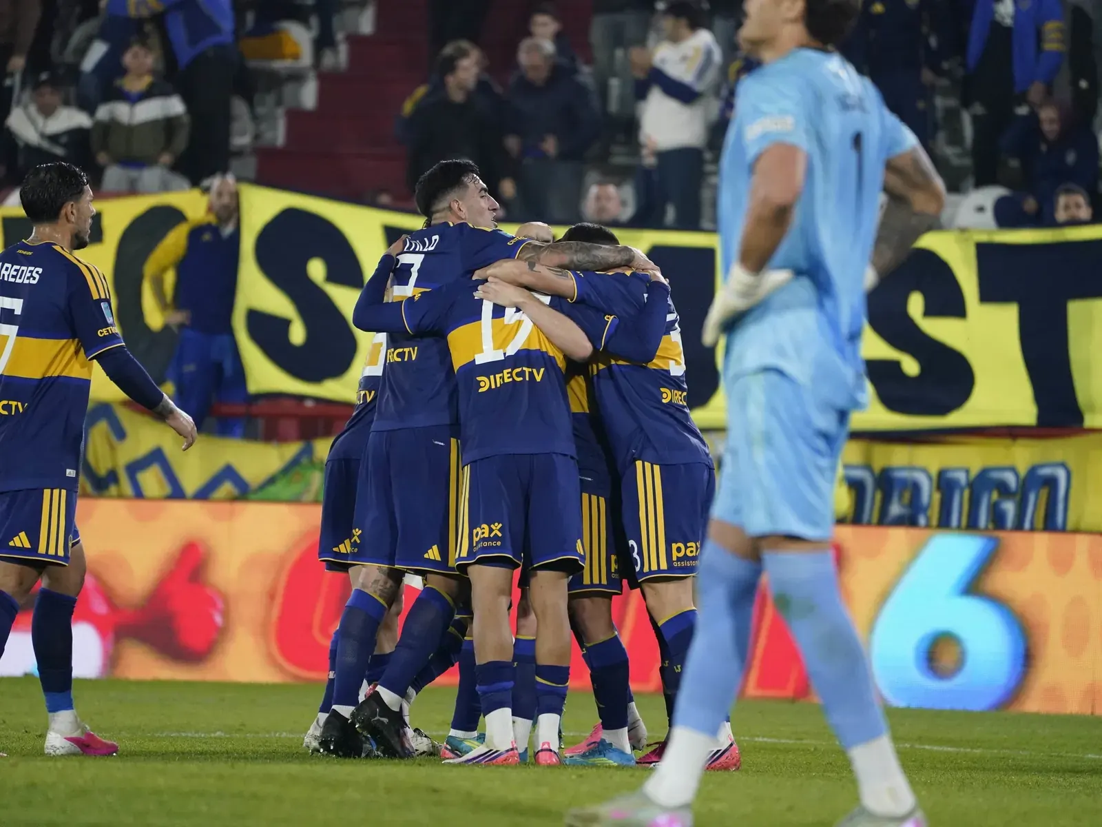 Boca Juniors players celebrating during a Torneo Clausura match at Tomás Adolfo Ducó.