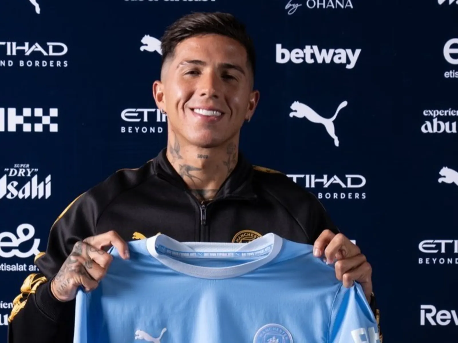 Enzo Fernández wearing Manchester City's home kit during his official presentation at the Etihad Campus