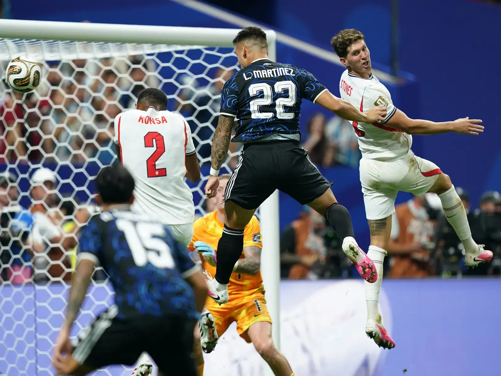 Argentina's Lautaro Martinez heads the ball past England goalkeeper Jordan Pickford to score the winning goal in the 2026 World Cup semi-final.